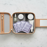 The Wipe purple sachets in travel case